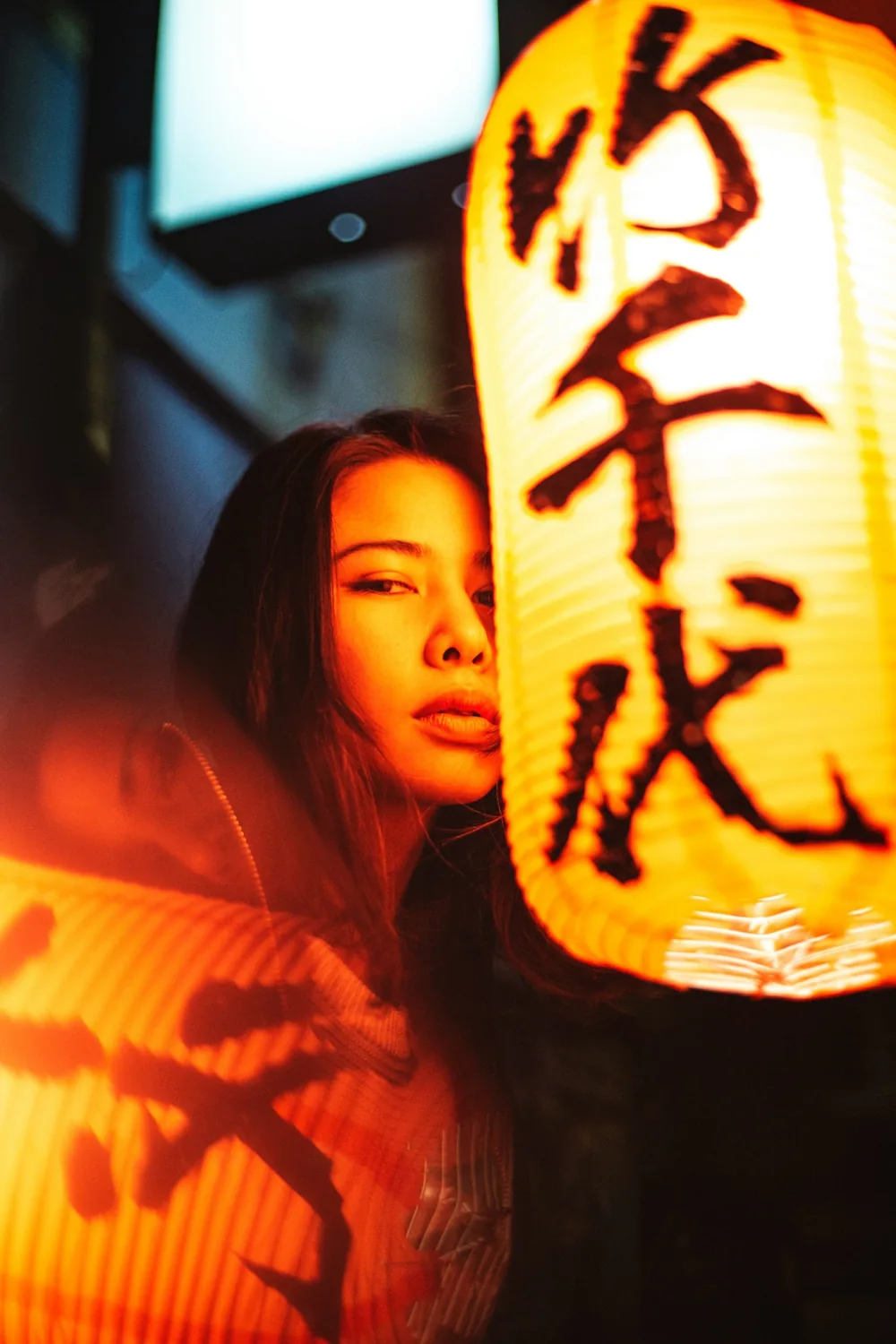 Portrait beside a glowing lantern